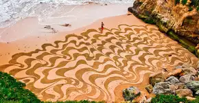 Artista usa praias como tela e cria desenhos na areia