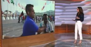 Sem perceber que estava ao vivo, repórter da Globo dá empurrão em torcedor