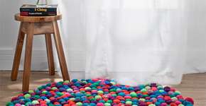 Faça você mesmo um tapete de pompons de lã para o inverno